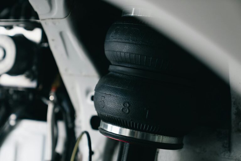 Detailed view of a vehicle's air suspension component with focus on texture and design.